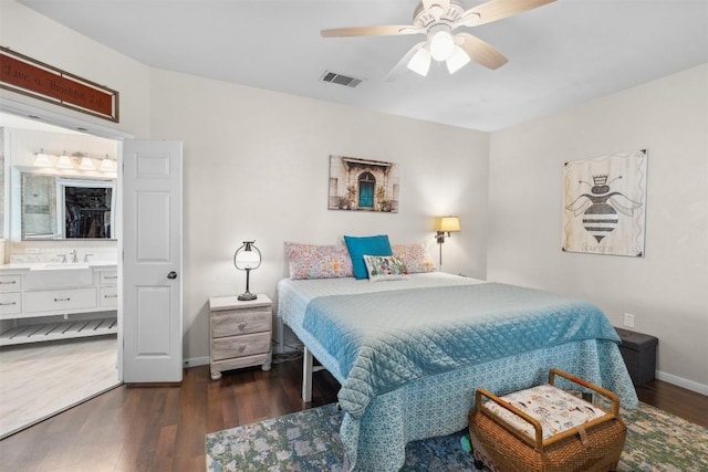 30310 Bumble Bee Dr, Georgetown, TX 78628 - bedroom featuring connected bathroom, ceiling fan, baseboards, wood finished floors, and visible vents