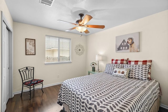 30310 Bumble Bee Dr, Georgetown, TX 78628 - bedroom with visible vents, a closet, wood finished floors, baseboards, and ceiling fan