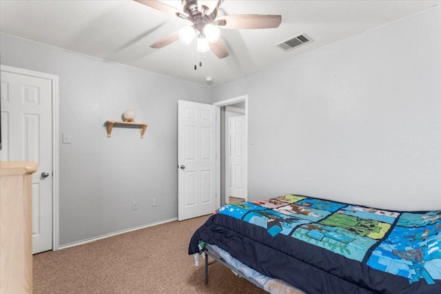 107 Jefferson Cv, Elgin, TX 78621 - bedroom featuring carpet, visible vents, a ceiling fan, and baseboards