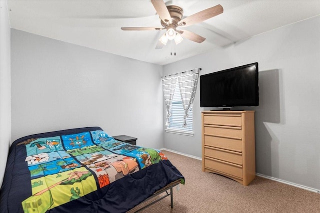 107 Jefferson Cv, Elgin, TX 78621 - bedroom featuring light colored carpet, a ceiling fan, and baseboards