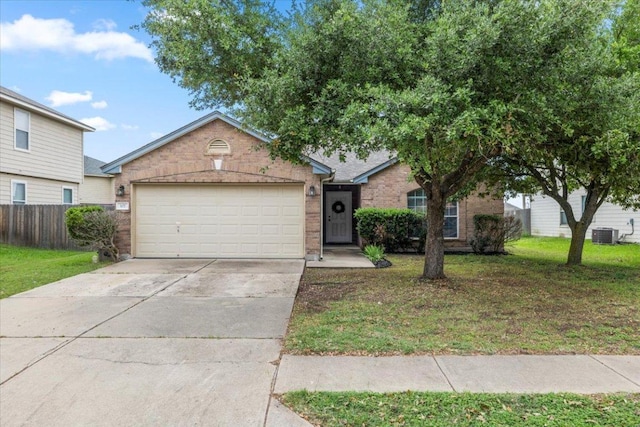 107 Jefferson Cv, Elgin, TX 78621 - view of front of house with concrete driveway, fence, a front lawn, brick siding, and a garage