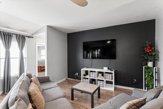 107 Jefferson Cv, Elgin, TX 78621 - living room featuring baseboards, wood finished floors, and ceiling fan