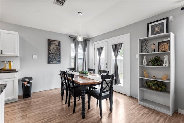 107 Jefferson Cv, Elgin, TX 78621 - dining room with visible vents, light wood-type flooring, and french doors