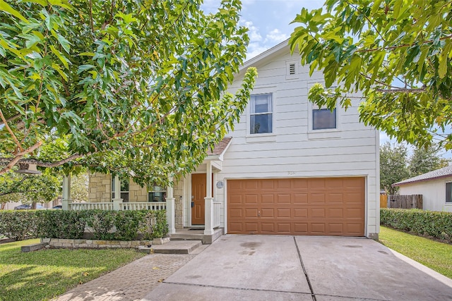 view of front of home with driveway and a garage