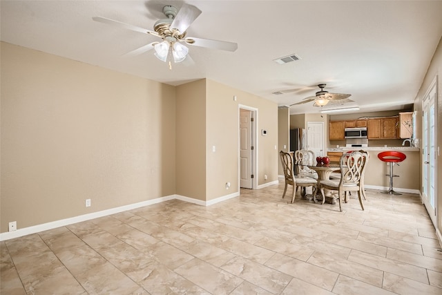 8201 Georgie Trace Ave, Austin, TX 78747 - dining room featuring ceiling fan