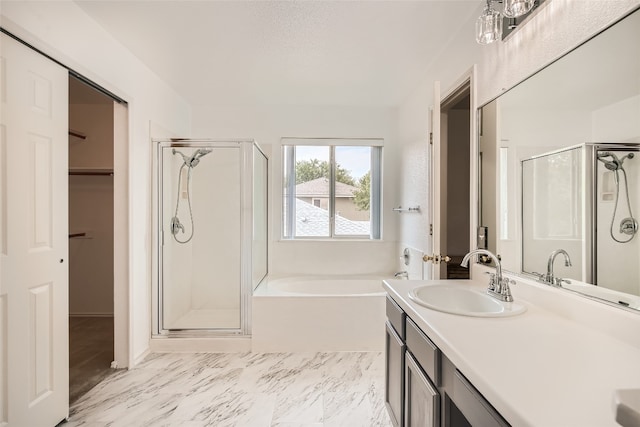 8201 Georgie Trace Ave, Austin, TX 78747 - full bathroom with a shower stall, a bath, vanity, and a spacious closet