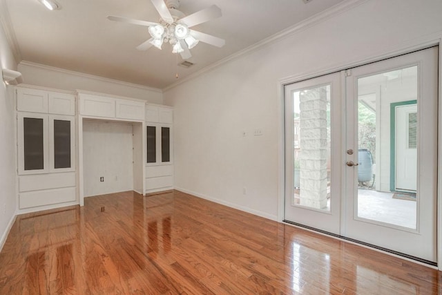unfurnished bedroom with crown molding, light wood-style flooring, baseboards, french doors, and access to outside