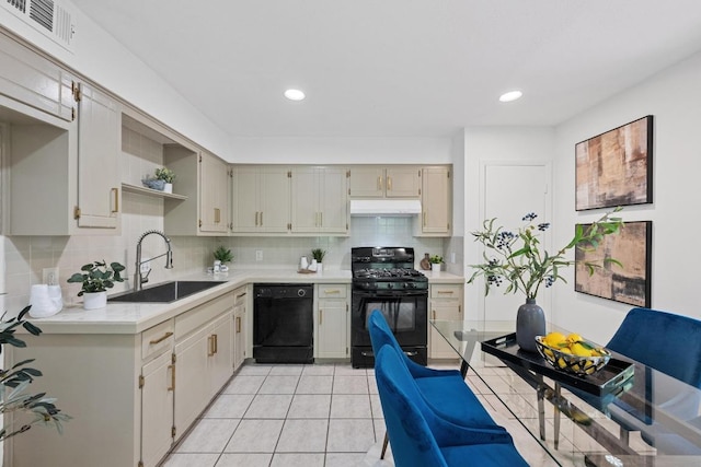 1511 Terrapin Ct Unit B, Austin, TX 78746 - kitchen with black appliances, under cabinet range hood, light countertops, decorative backsplash, and light tile patterned floors