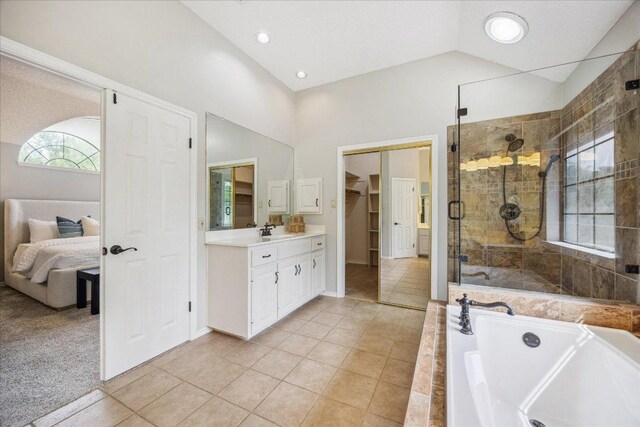 9007 Tweed Berwick Dr, Austin, TX 78750 - full bathroom with a shower stall, vanity, a garden tub, tile patterned floors, and a spacious closet