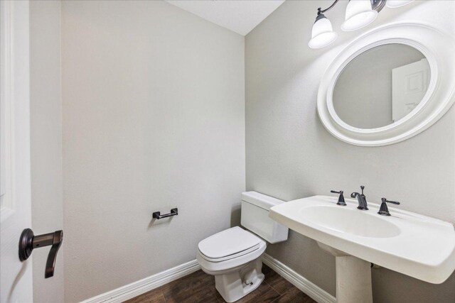9007 Tweed Berwick Dr, Austin, TX 78750 - half bath with wood finished floors and baseboards