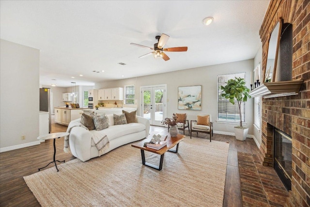 9007 Tweed Berwick Dr, Austin, TX 78750 - living area with baseboards, a fireplace, a ceiling fan, dark wood-style flooring, and recessed lighting