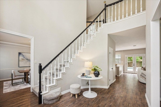 9007 Tweed Berwick Dr, Austin, TX 78750 - staircase featuring wood finished floors, a high ceiling, baseboards, and french doors