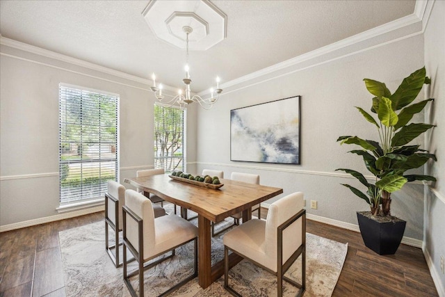 9007 Tweed Berwick Dr, Austin, TX 78750 - dining area featuring ornamental molding, wood finished floors, baseboards, a textured ceiling, and a notable chandelier