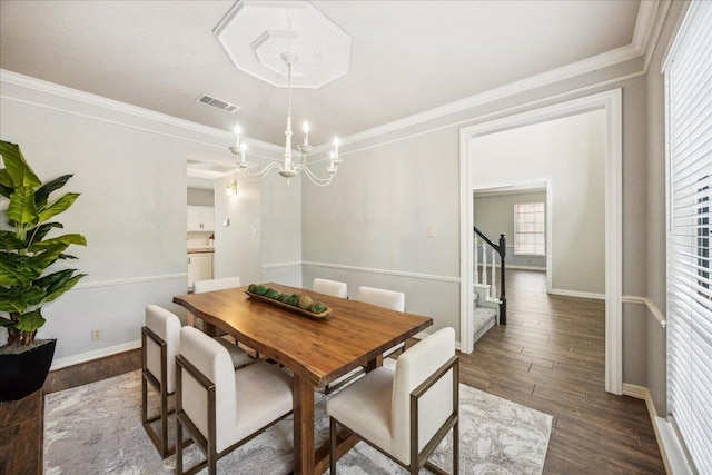 9007 Tweed Berwick Dr, Austin, TX 78750 - dining room with visible vents, stairs, wood finished floors, and a chandelier