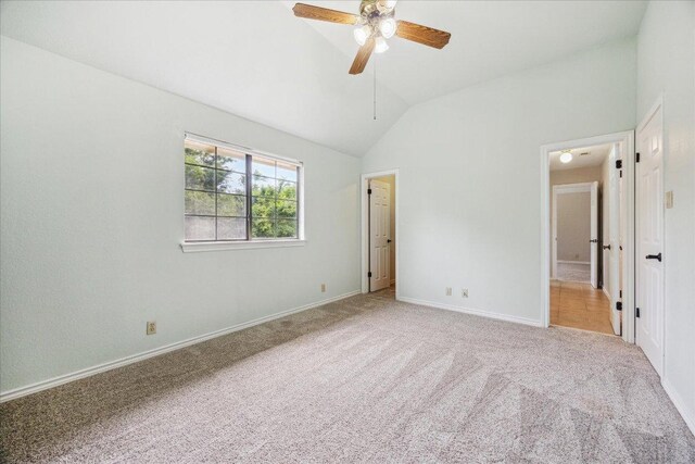 9007 Tweed Berwick Dr, Austin, TX 78750 - unfurnished bedroom featuring carpet floors, vaulted ceiling, baseboards, and a ceiling fan