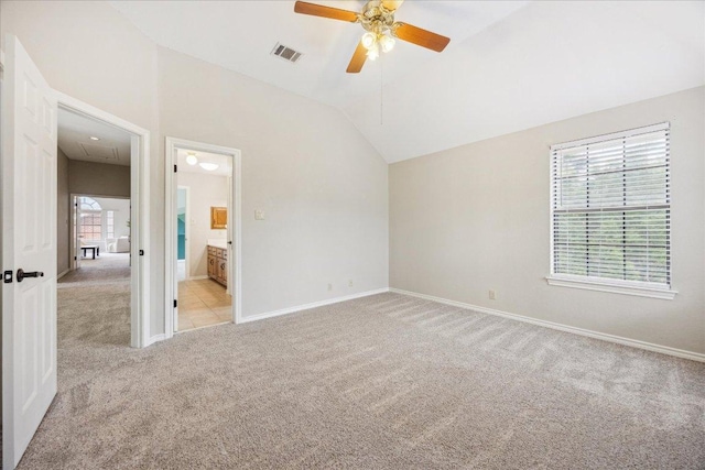 9007 Tweed Berwick Dr, Austin, TX 78750 - unfurnished bedroom featuring attic access, light colored carpet, visible vents, baseboards, and lofted ceiling