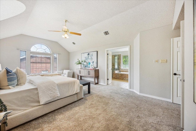 9007 Tweed Berwick Dr, Austin, TX 78750 - carpeted bedroom with visible vents, baseboards, connected bathroom, a ceiling fan, and vaulted ceiling