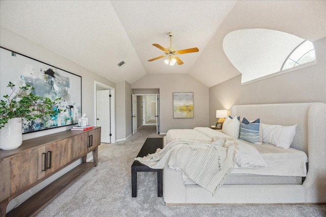 9007 Tweed Berwick Dr, Austin, TX 78750 - bedroom with a ceiling fan, visible vents, light colored carpet, baseboards, and lofted ceiling