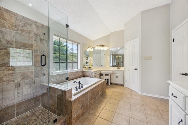 9007 Tweed Berwick Dr, Austin, TX 78750 - full bathroom with tile patterned flooring, vanity, a shower stall, lofted ceiling, and a bath