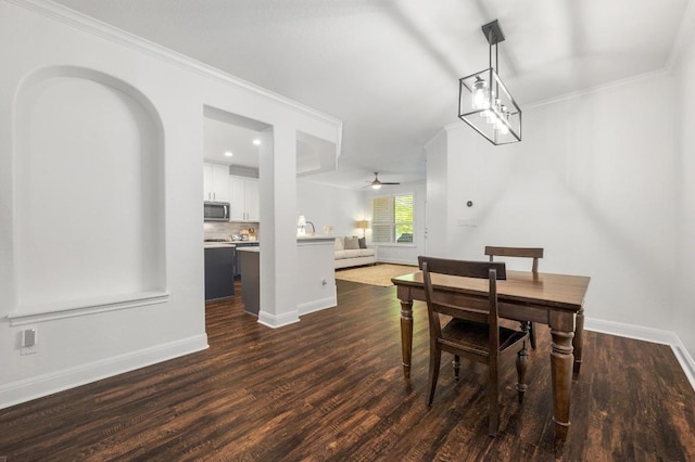 108 Perpetuation Dr Unit 802, Lakeway, TX 78734 - dining space with dark wood-type flooring, baseboards, crown molding, and a ceiling fan