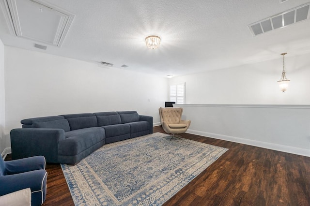 108 Perpetuation Dr Unit 802, Lakeway, TX 78734 - living room with attic access, dark wood finished floors, and baseboards