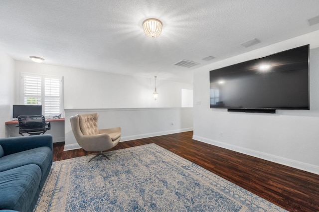 108 Perpetuation Dr Unit 802, Lakeway, TX 78734 - living room featuring wood finished floors, baseboards, and a textured ceiling