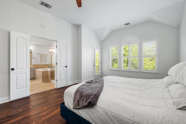 108 Perpetuation Dr Unit 802, Lakeway, TX 78734 - bedroom featuring dark wood-type flooring, vaulted ceiling, baseboards, connected bathroom, and a ceiling fan