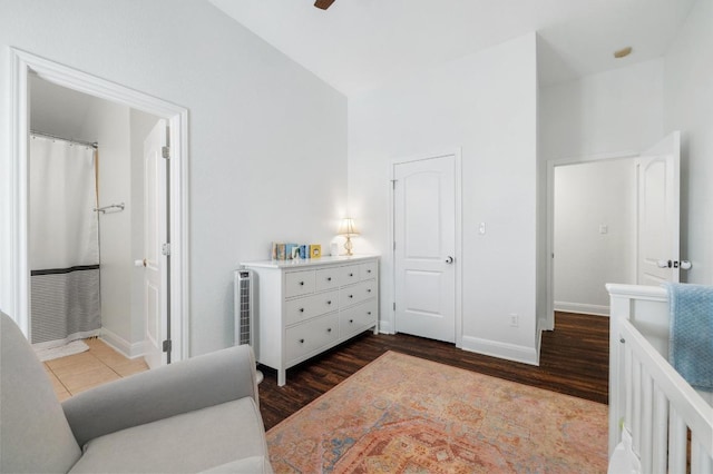 108 Perpetuation Dr Unit 802, Lakeway, TX 78734 - bedroom featuring baseboards, lofted ceiling, wood finished floors, and ensuite bath