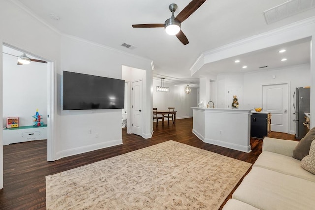 108 Perpetuation Dr, Austin, TX 78734 - living area featuring a ceiling fan, ornamental molding, dark wood-type flooring, and recessed lighting