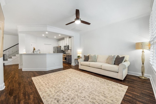 108 Perpetuation Dr Unit 802, Lakeway, TX 78734 - living room with a ceiling fan, dark wood finished floors, baseboards, crown molding, and stairs