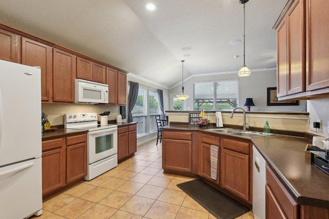 kitchen with dark countertops, white appliances, vaulted ceiling, and a sink