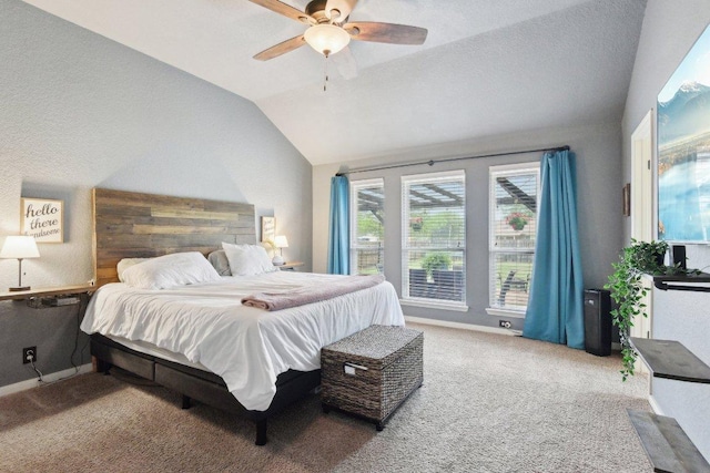 bedroom with baseboards, a ceiling fan, carpet floors, and lofted ceiling