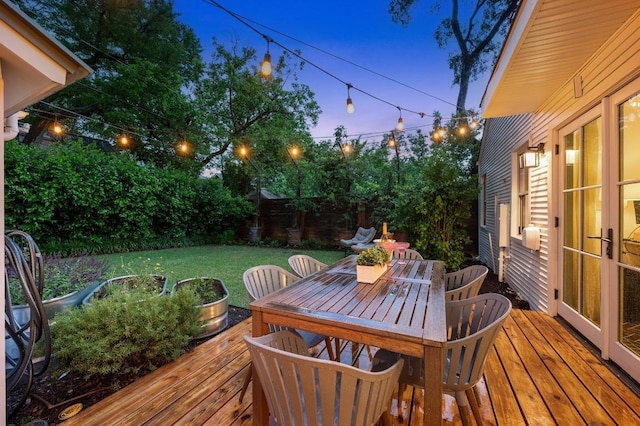 1107 Maufrais St, Austin, TX 78703 - wooden deck with outdoor dining area and a fenced backyard