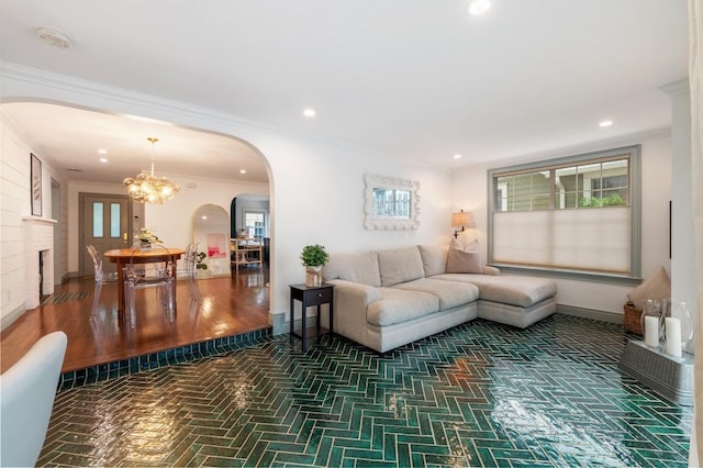 1107 Maufrais St, Austin, TX 78703 - living area with arched walkways, a chandelier, crown molding, and recessed lighting
