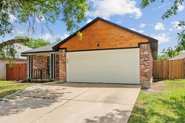 609 Clearwater Trl, Round Rock, TX 78664 - view of front of home with concrete driveway, brick siding, and a garage