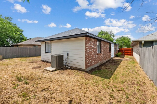 609 Clearwater Trl, Round Rock, TX 78664 - view of side of home featuring brick siding and central air condition unit