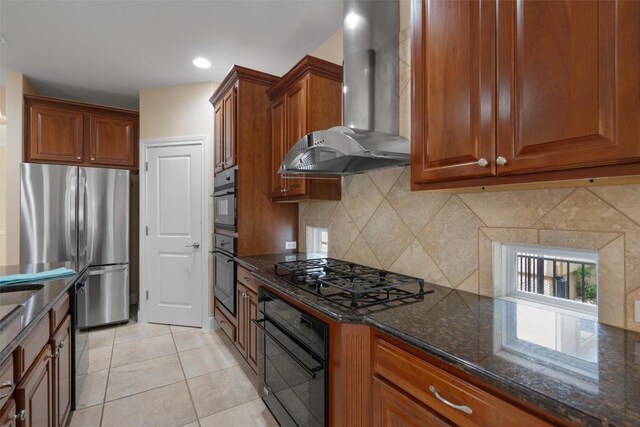 202 Goose Island Dr, Georgetown, TX 78633 - kitchen with wall chimney range hood, black appliances, decorative backsplash, brown cabinets, and dark stone counters