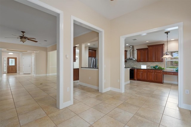 202 Goose Island Dr, Georgetown, TX 78633 - kitchen with freestanding refrigerator, wall chimney range hood, light tile patterned flooring, and decorative backsplash