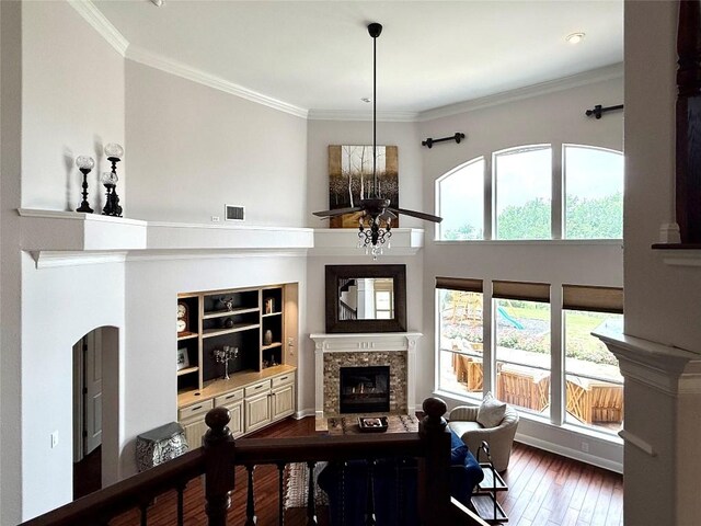 804 Lakewood Hills Ter, Austin, TX 78732 - living area with a fireplace, hardwood / wood-style flooring, ornamental molding, built in features, and ceiling fan