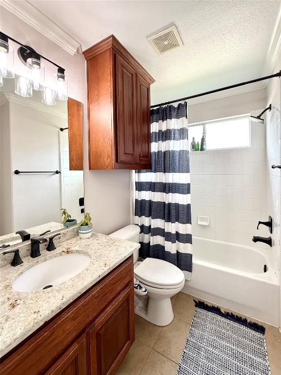 804 Lakewood Hills Ter, Austin, TX 78732 - bathroom with vanity, shower / tub combo with curtain, tile patterned flooring, and crown molding