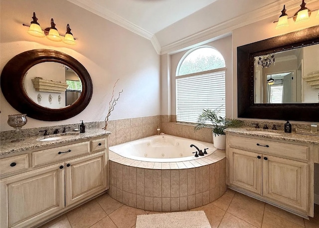 804 Lakewood Hills Ter, Austin, TX 78732 - full bath featuring tile patterned flooring, a jetted tub, ornamental molding, two vanities, and vaulted ceiling