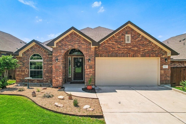 view of front of home with concrete driveway, a garage, a shingled roof, and brick siding
