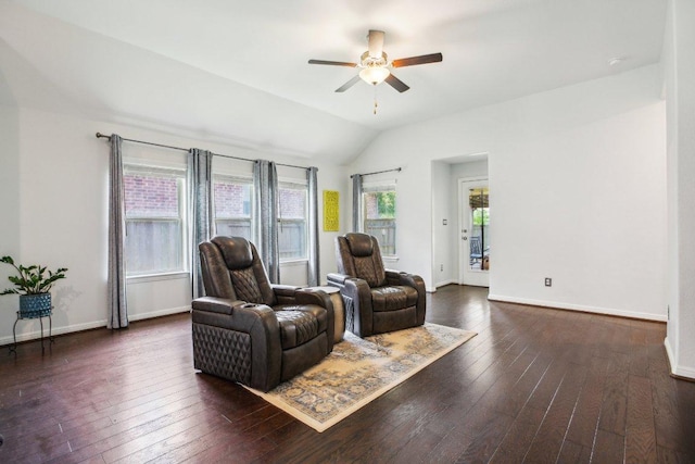 interior space featuring hardwood / wood-style floors, baseboards, ceiling fan, and vaulted ceiling