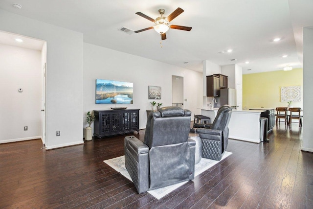 living room featuring recessed lighting, visible vents, ceiling fan, and dark wood-style flooring