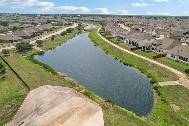 bird's eye view with a residential view and a water view