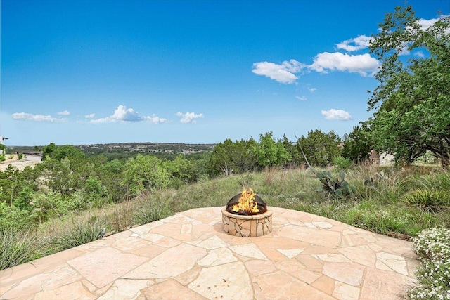 view of patio / terrace featuring a fire pit