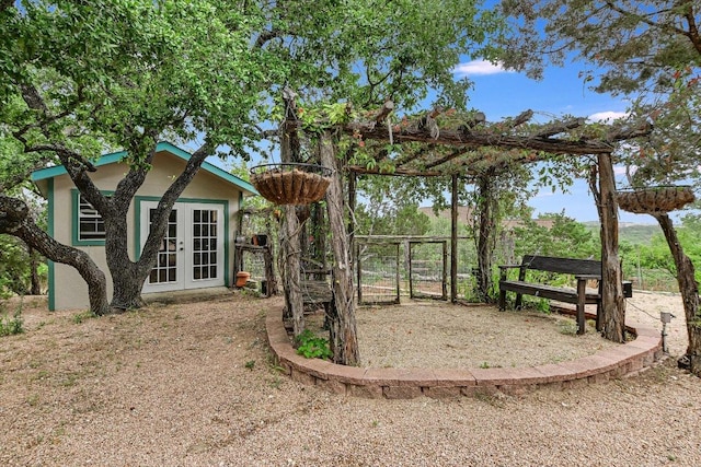 5000 High Canyon Pass, Austin, TX 78738 - view of yard with french doors and a gate