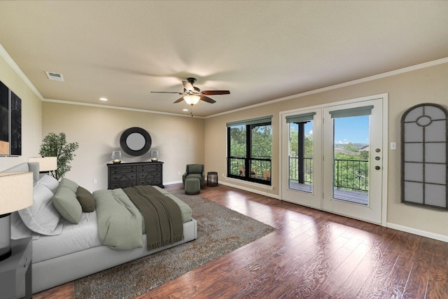 bedroom with access to exterior, visible vents, wood finished floors, and baseboards