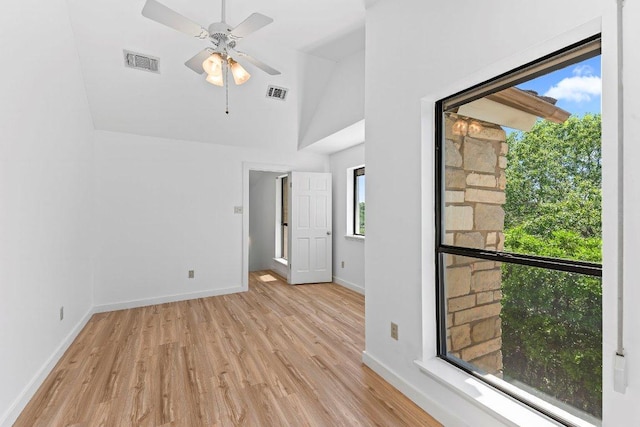 1313 Spyglass Dr, Austin, TX 78746 - unfurnished room featuring a ceiling fan, visible vents, light wood-style flooring, and baseboards
