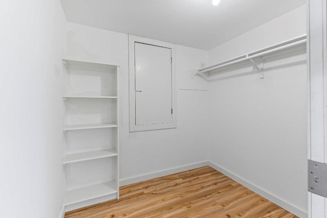 1313 Spyglass Dr, Austin, TX 78746 - spacious closet with wood finished floors